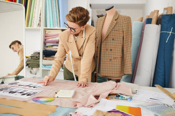 istock Fashion designer working with sketches 1223003636