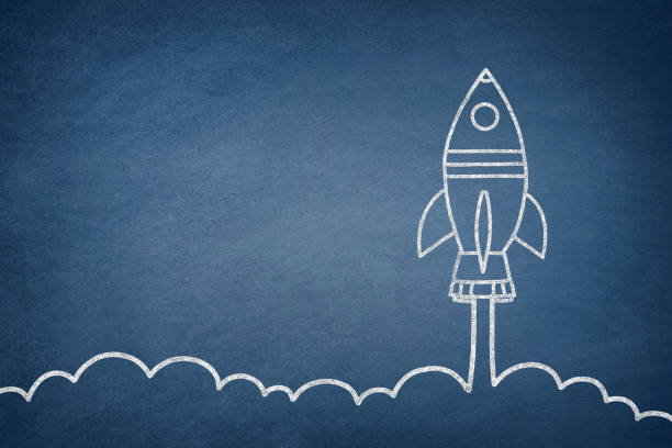 istock Business Startup Concept with Spaceship on Blackboard 1223003995