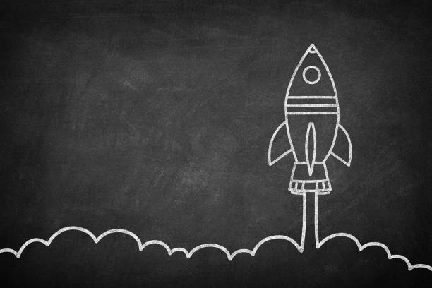 istock Business Startup Concept with Spaceship on Blackboard 1223004169