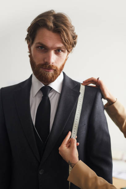 istock Man sewing a suit from a designer 1223004208