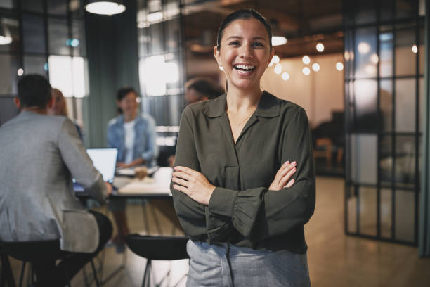 istock Young businesswoman laughing while working in a modern office 1223006835
