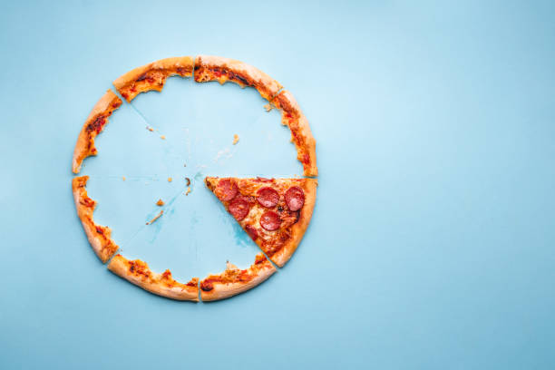 istock Last piece of pizza pepperoni on blue background 1223007167