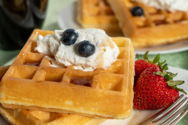 istock belgian waffles on plate with fruit 1223008292