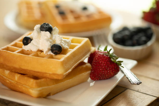 istock belgian waffles on plate with fruit 1223008335