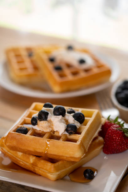 istock belgian waffles on plate with fruit 1223008354