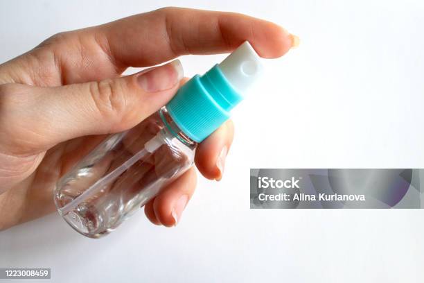Transparent Spray Bottle In Hand Health Concept Antiseptic Coronavirus Control Measures Stock Photo - Download Image Now