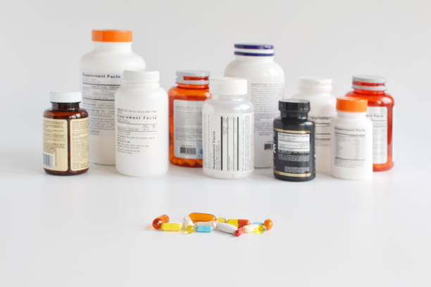 istock Group of supplement bottle with pills on a white background 1223009895