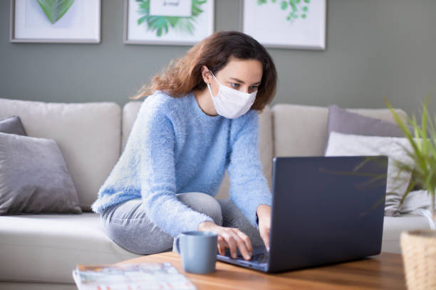 istock Young woman working on laptop at home 1223010219