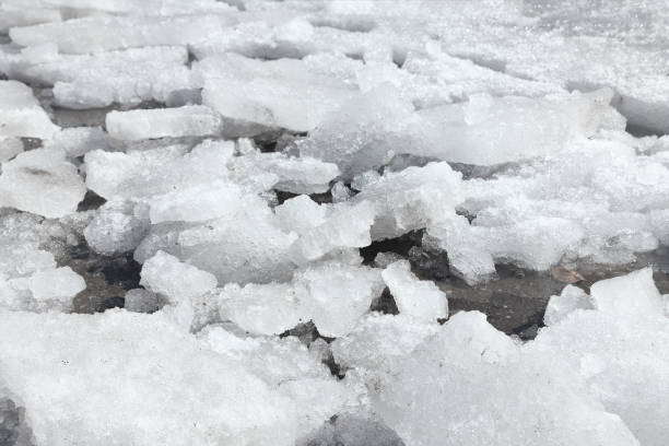 istock Broken dirty ice on an asphalt road. In the spring, utilities work. 1223011889