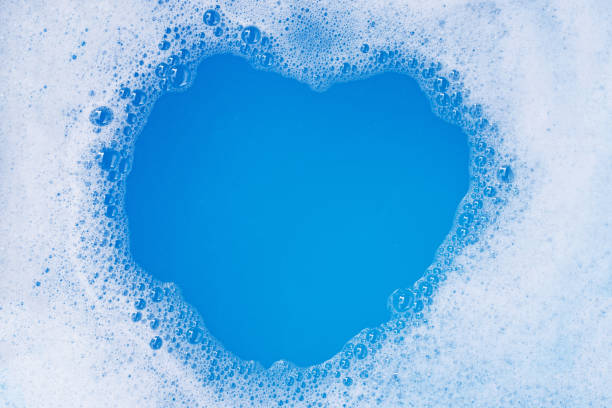 istock Frame made of detergent foam bubble. Blue background. Heart shape 1223013021