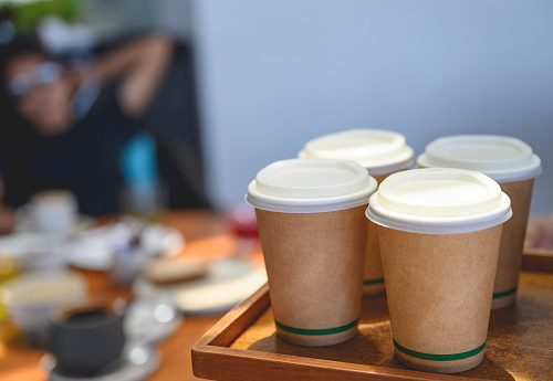 Coffee to go in disposable cups in a cafe, Nikon Z7