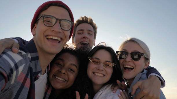 istock Group of multi-ethnic young people having fun taking selfie 1223013058