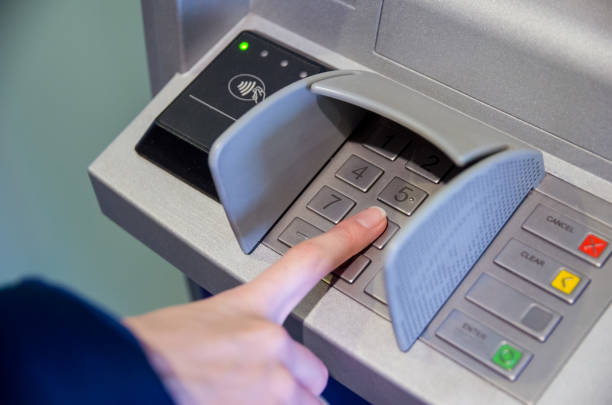 istock Close-up of hand entering PIN/pass code on ATM/bank machine keypad 1223014243
