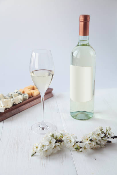 istock Bottle of wine, cheese and flowers 1223014698