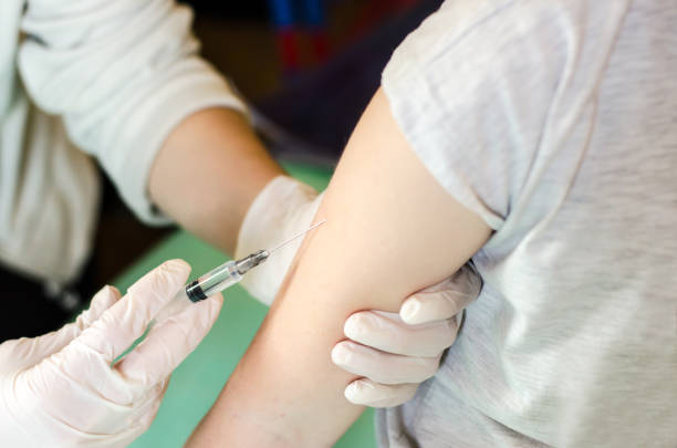 istock The doctor vaccinates the child. Vaccination concept. 1223015381
