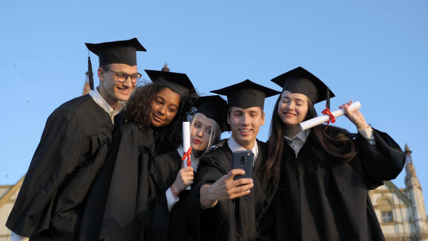 istock Multi ethnic group of graduated students taking selfie 1223015447