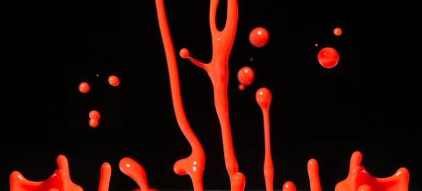 istock Fun shiny swirly paint splashes on a black background 1223015584