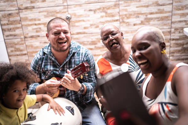 Family on a video chat while playing music at home - video chat