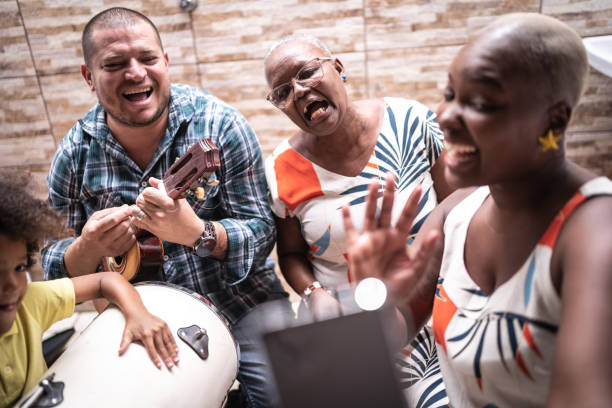 istock Family on a video chat while playing music at home - video chat 1223015998