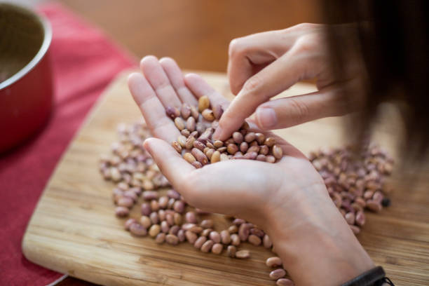Mother and son, cleaning beans at home