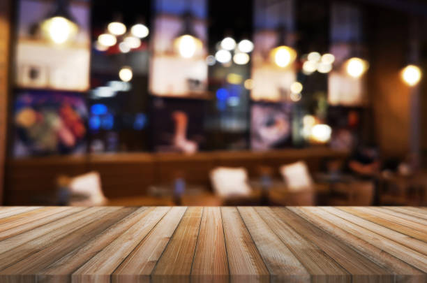 istock wooden table with abstract blurred background restaurant lights used for display montage products mock up design. 1223017675