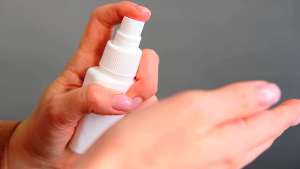 istock A focus on a woman who is desinfecting her hands 1223022055