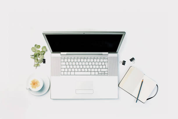 istock White desk office with laptop 1223022360