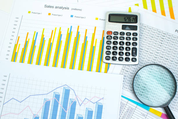 istock Financial printed paper charts, graphs and diagrams on the table. Top view 1223022657