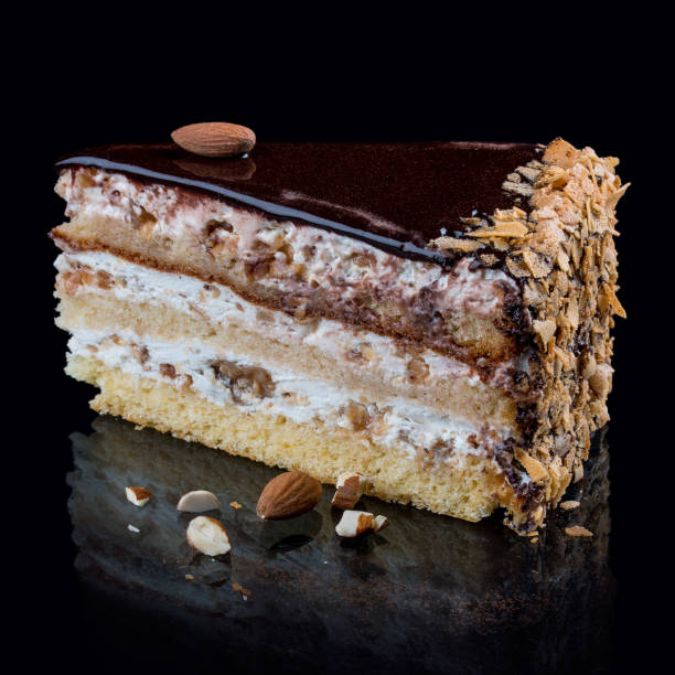 istock Cake with three types of caramel nuts on a black background 1223023809