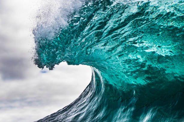 istock Close up of a clean blue breaking wave with offshore wind 1223025286