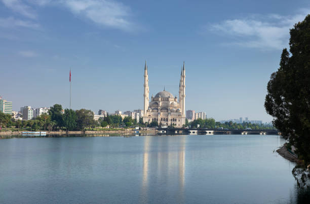 The historic stone bridge and Adana Sabanci Central Mosque, Turkey.