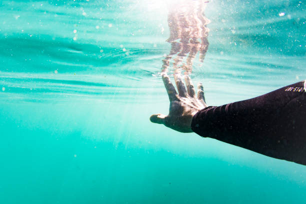 istock Touching the surface from underwater while swimming in the sea 1223025676