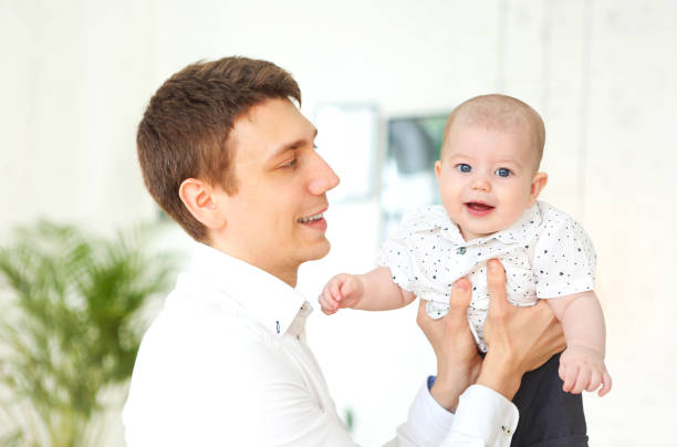 istock Happy young father holding baby boy 1223026779