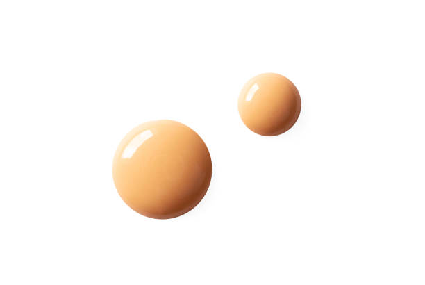 istock Isolated BB cream or CC cream smear sample on white background. Beige liquid shiny creamy foundation drops. Concealer smudge spot, above. Cosmetic fluid corrector smooth, macro 1223027230