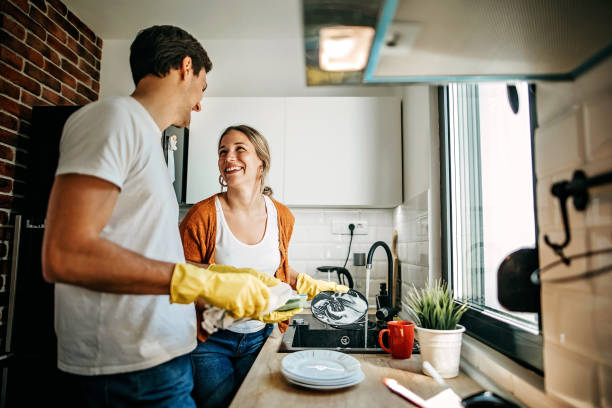 istock Couple cleaning dishes at home 1223031260