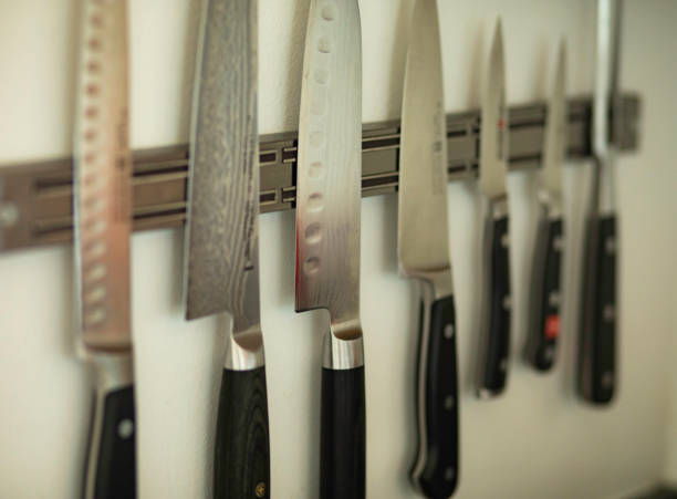 istock Professional Chef's Knives hanging on a wall 1223031796
