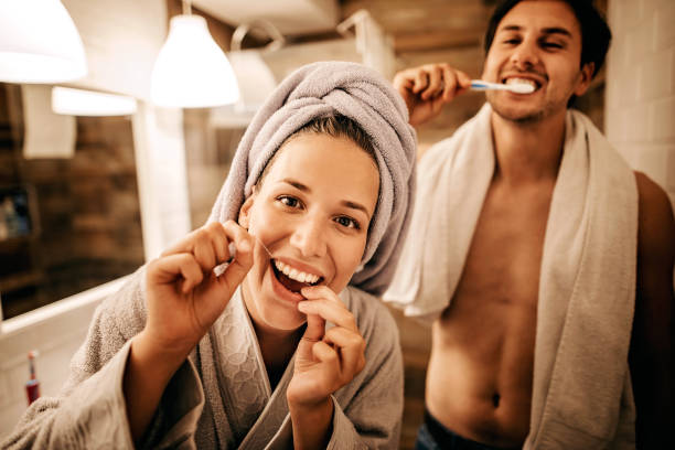 perfect smile - brushing teeth women toothbrush brushing imagens e fotografias de stock