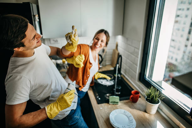 istock Couple cleaning dishes at home 1223032804