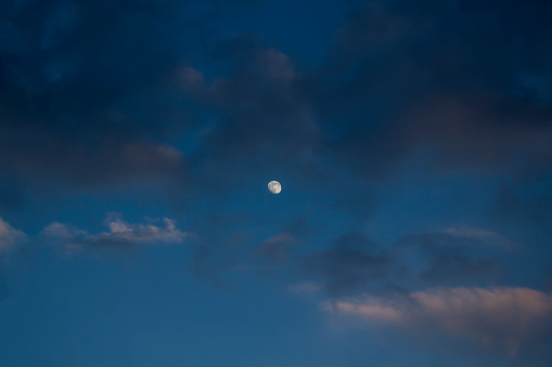 Half moon on the dark blue sky.