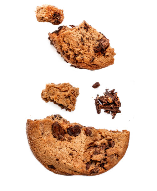 istock Chocolate butter  chip cookie isolated on white background.  Cookies broken in pieces with crumbs close up.
