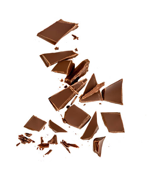 istock Falling Chocolate pieces and  shavings  isolated on white background