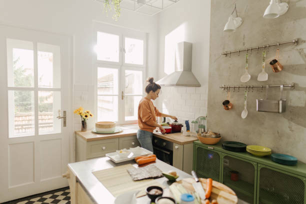 istock Young woman cooking rice for sushi 1223036395