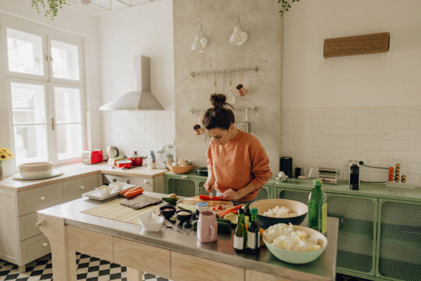 istock Woman slicing vegetables for sushi 1223036507
