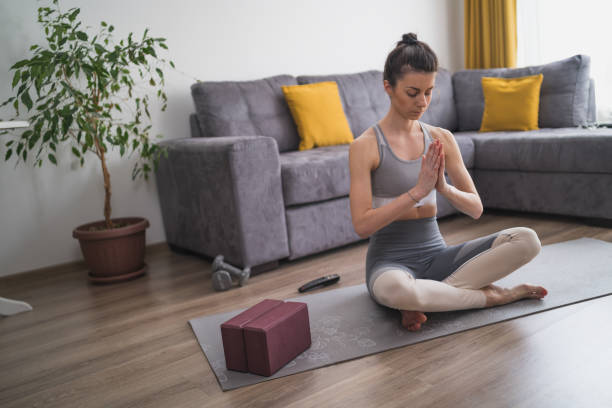 istock meditation at home doing yoga poses 1223036892