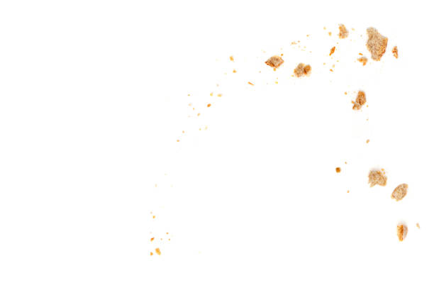 Bread slices and crumbs isolated on white background. Top view
