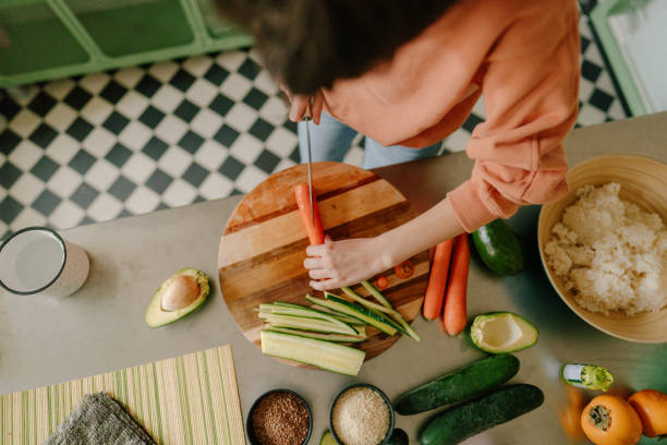 istock Woman prepping vegetables for sushi 1223037657