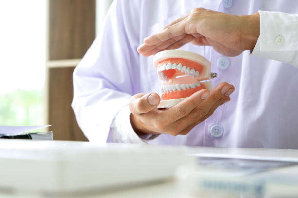 istock dentist work on the table with Denture and teeth x-ray 1223038326