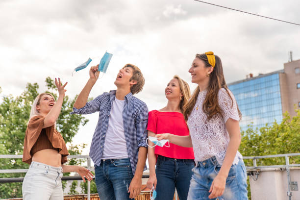 istock FOUR YOUNG PEOPLE FEELING HAPPY ABOUT FINISHED LOCKDOWN 1223039687