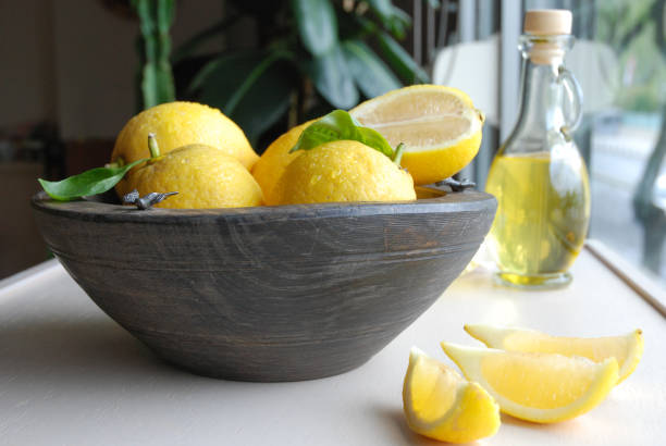 istock Lemons sliced on a kitchen table in a bowl 1223040952