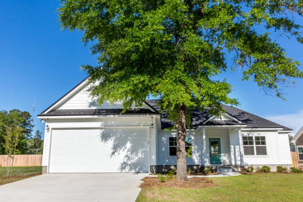 istock Exterior facade of a white new construction house 1223041260
